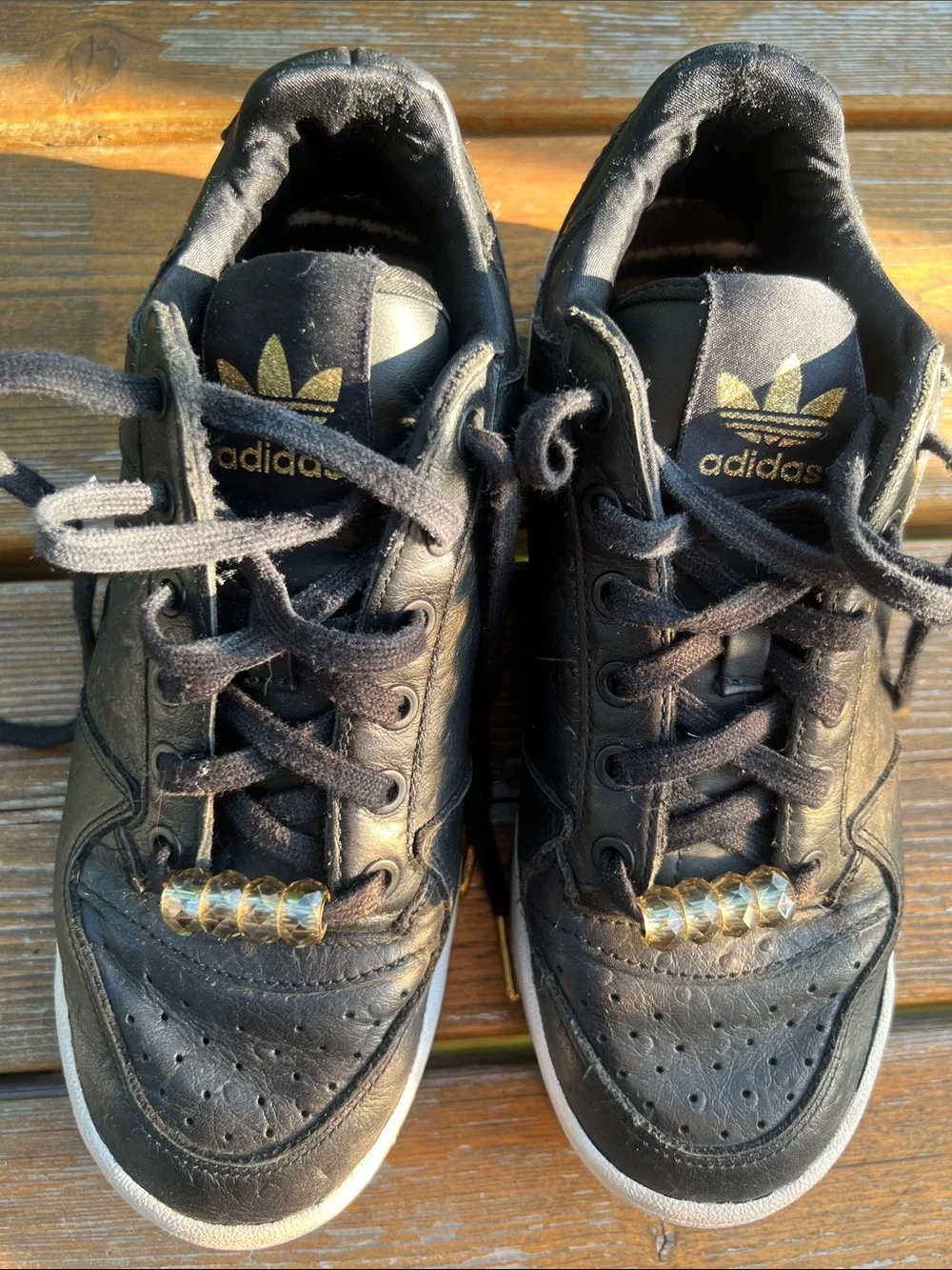 adidas Forum Black Leather Low-Top Sneakers with Gold Accents